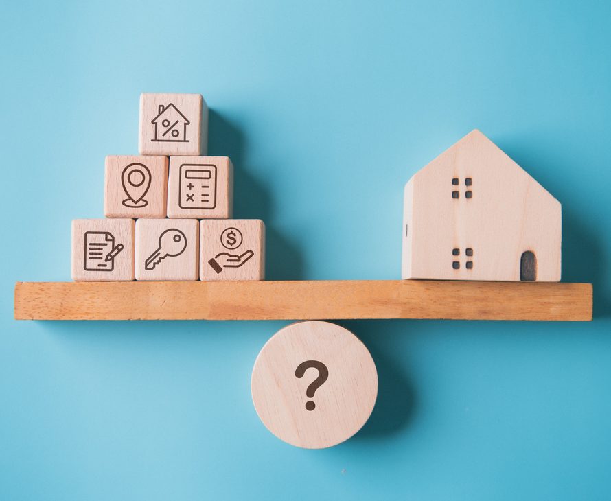 House buying factor with real estate home on weighting balance scale on blue background. Business mortgage loan investment and Property management team concept.